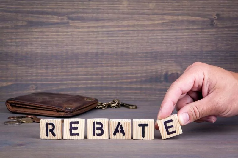 Wooden tiles arranged to spell "rebate"